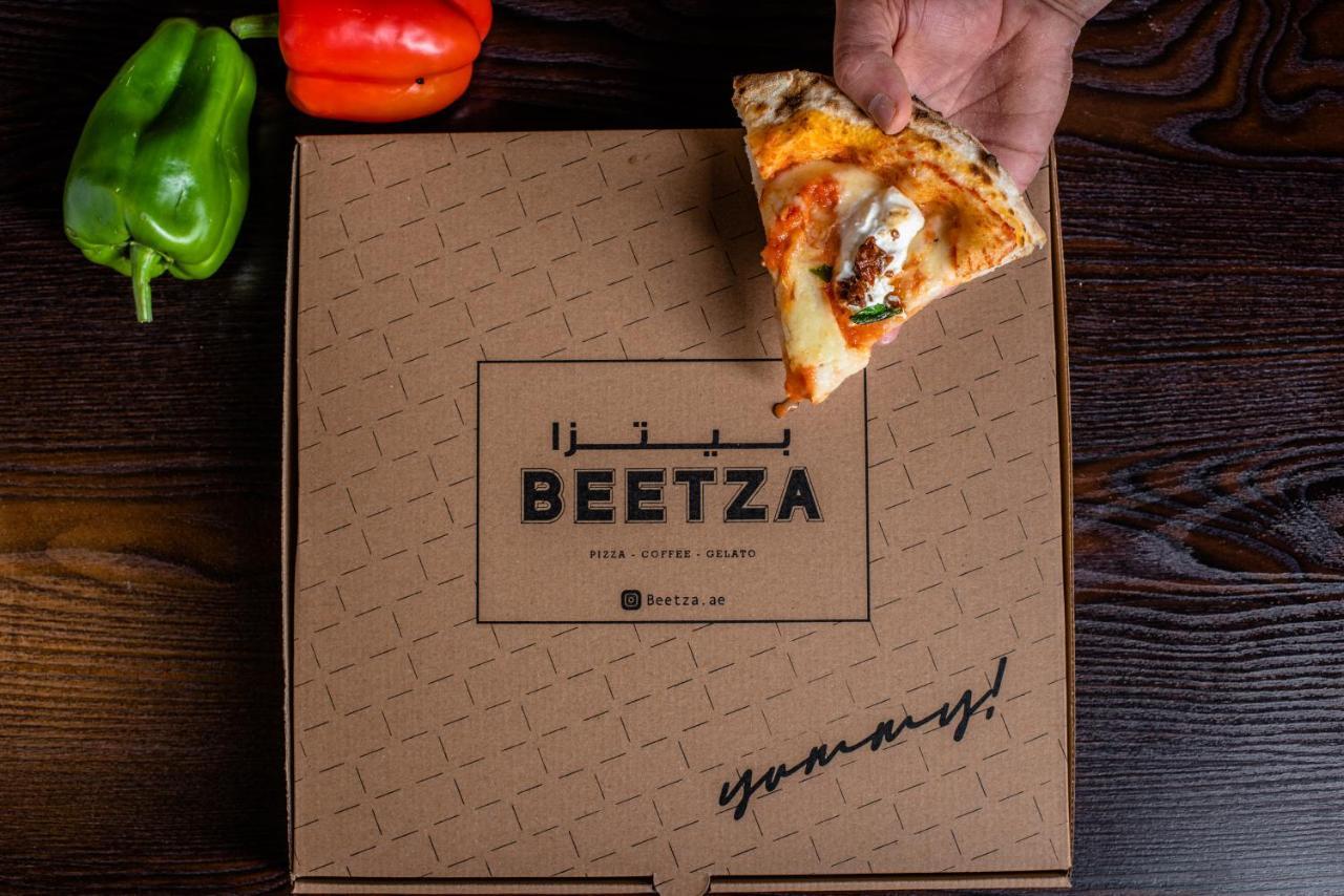 Officers Club & Hotel Abu Dabi Exterior foto Beetza pizza